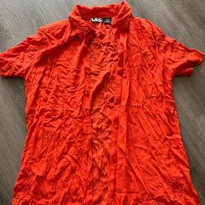 Orange rayon short sleeve shirt with light  shoulder padding and embroidery